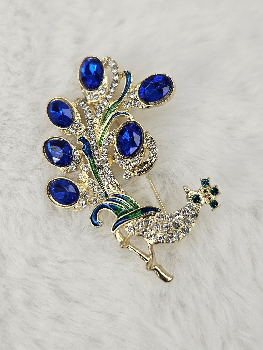 Gold-Tone Peacock Brooch with Royal Blue Crystals